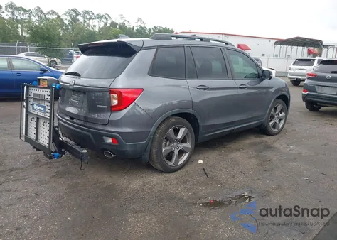 2021 Honda Passport 2Wd Touring from USA, damaged, VIN 5FNYF7H98MB012921